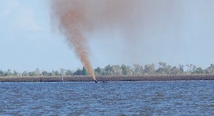 Oil leaking from well head in Barataria Bay in Lafitte, Louisiana.